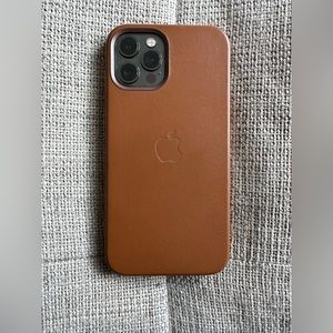 iPhone 12 Pro regular leather case with magnetic charger. Like new.